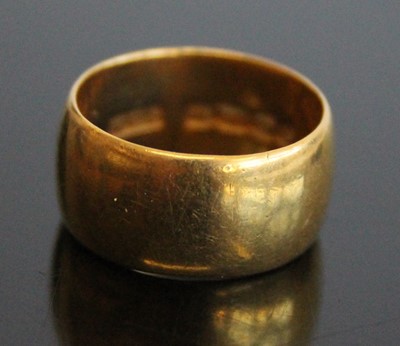 Lot 2857 - A 22ct gold wedding band, sponsor WCS, 8.2g,...