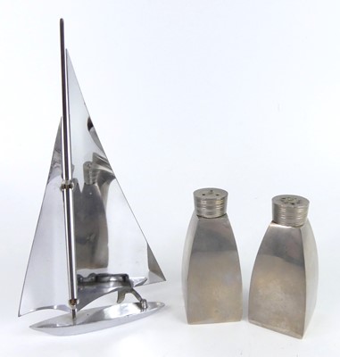 Lot 108 - A 1960s chrome model sailing boat, h.21cm,...