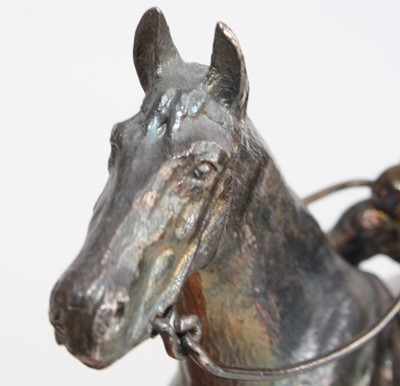 Lot A silver equestrian figure group of a horse...