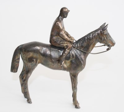 Lot A silver equestrian figure group of a horse...