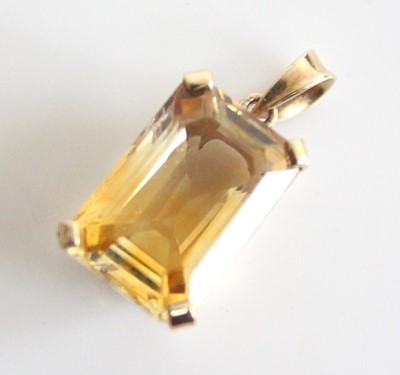 Lot 2823 - A yellow metal citrine pendant, featuring a...