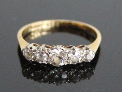 Lot 2830 - A yellow and white metal diamond half eternity...