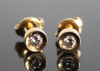 Lot 2831 - A pair of yellow metal diamond stud earrings,...