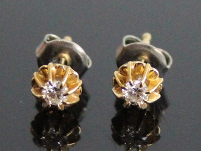 Lot 2835 - A pair of yellow metal diamond stud earrings,...