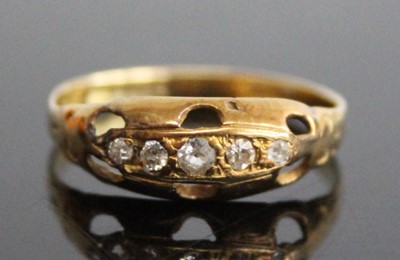 Lot 2841 - A yellow metal diamond half hoop ring,...