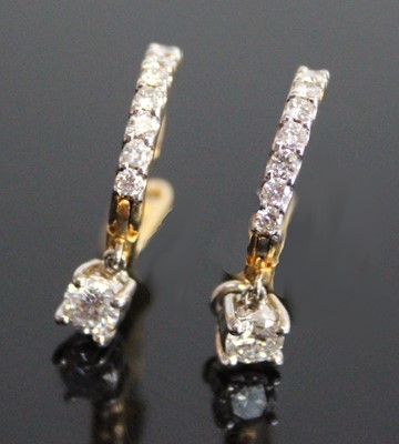 Lot 2842 - A pair of yellow and white metal diamond drop...