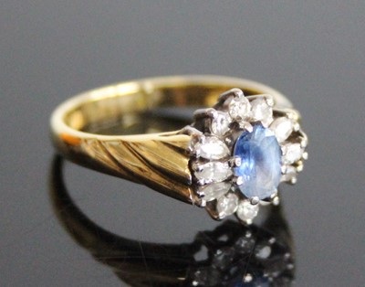 Lot 2278 - An 18ct yellow and white gold, sapphire and...