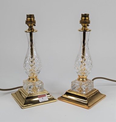 Lot 7 - A pair of brass and glass table lamps, each of...