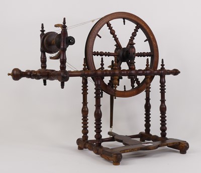 Lot 19 - A turned wood spinning wheel, height 51cm