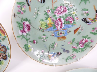 Lot 37 - A set of four Chinese celadon porcelain plates...