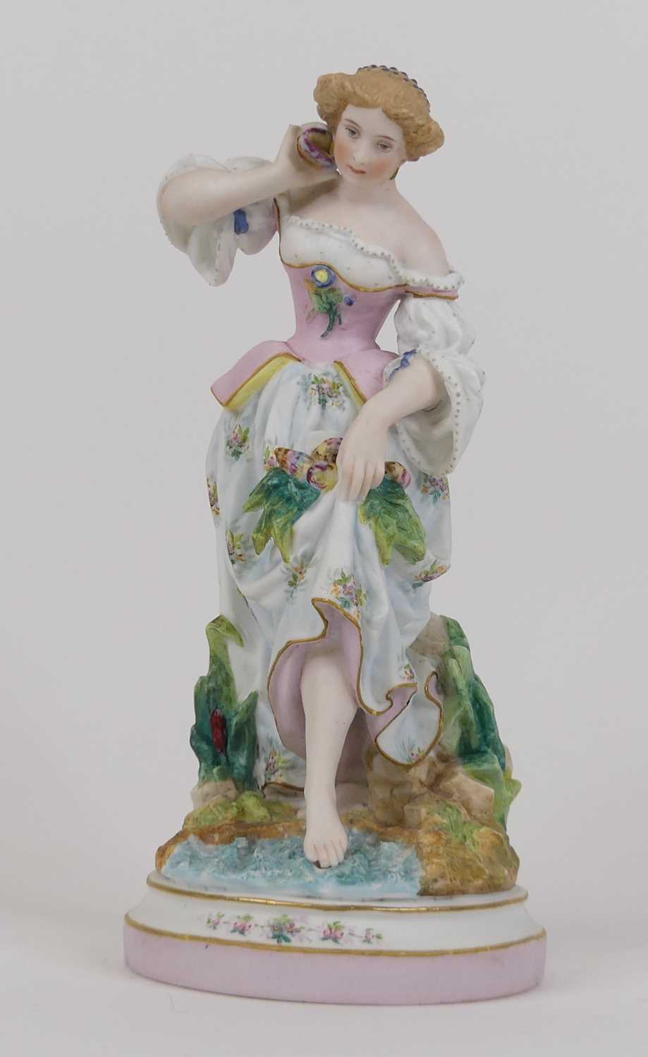 Lot 39 - A continental bisque porcelain figure of a...