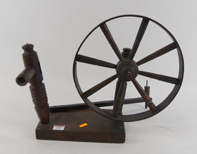 Lot 140 - A vintage oak spinning wheel, h.35cm