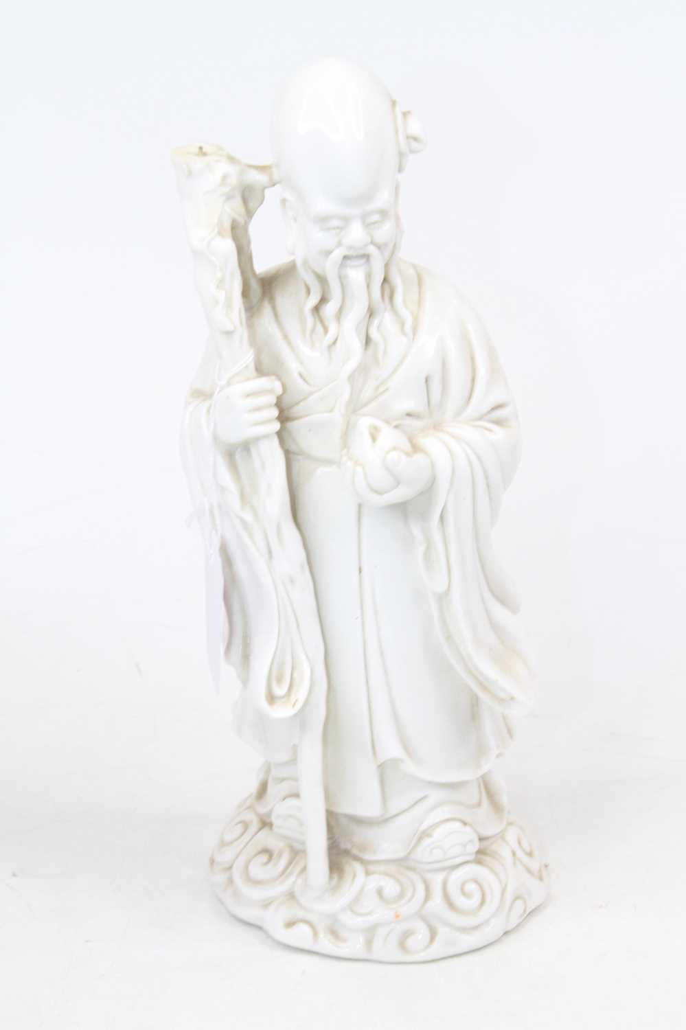 Lot 182 - A Chinese blanc-de-chine figure of The...