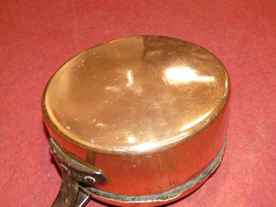 Lot 99 - A large 19th century copper saucepan having...