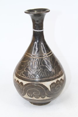 Lot 220 - A Chinese vase, decorated with foliage, h.27cm