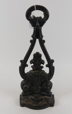 Lot 125 - A black painted cast iron doorstop, in the...