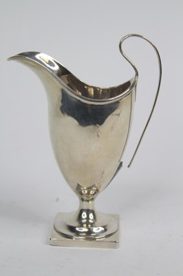 Lot 249 - A George III silver cream jug, of helmet shape,...