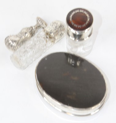Lot 280 - Two silver lidded glass dressing table jars,...