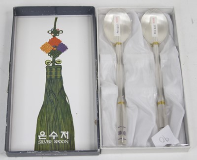 Lot 250 - A Chinese white metal spoon and chopstick set,...