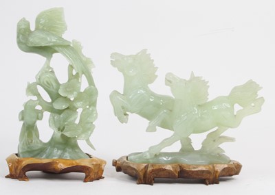 Lot 515 - Two Chinese green carved polished hardstone...