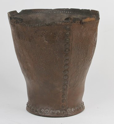 Lot 534 - A vintage leather waste paper basket, height 27cm