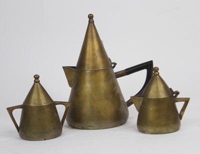 Lot 546 - An Art Deco brass three piece teaset, largest...