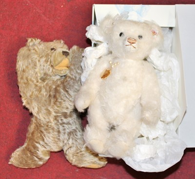 Lot 718 - A Steiff white mohair teddy-bear, having glass...