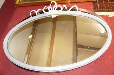Lot 1094 - A painted composition framed oval wall mirror,...