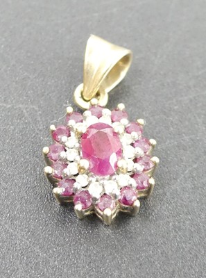 Lot 312 - A modern 9ct gold, ruby and diamond point set...