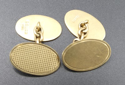 Lot 313 - A pair of 9ct gold engine turned gent's oval...