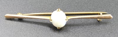 Lot 317 - A 9ct gold and cabochon opal set bar brooch, 2....