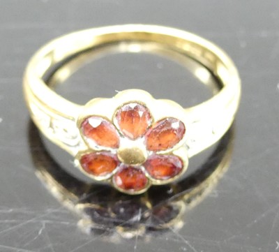 Lot 323 - A Victorian style 18ct gold garnet set flower...