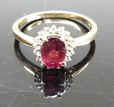 Lot 326 - A 9ct gold, garnet and cz set cluster ring,...