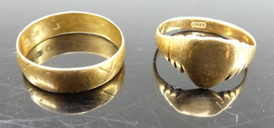 Lot 329 - An 18ct gold wedding band, size O; together...