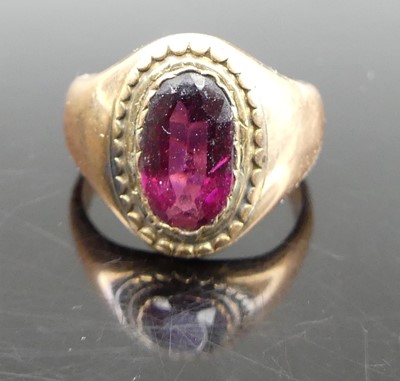 Lot 330 - A circa 1900 yellow metal and garnet(?) set...