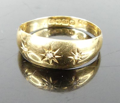 Lot 336 - An 18ct gold band ring, 'gypsy' set with three...