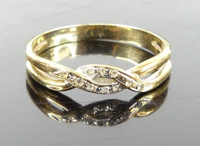 Lot 338 - A yellow metal and cz set band ring, stamped...