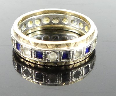 Lot 340 - A 9ct gold, sapphire and cz set eternity ring,...