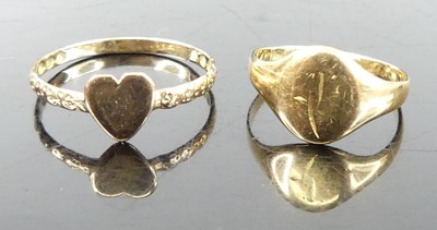 Lot 348 - A yellow metal band ring, with heart shaped...