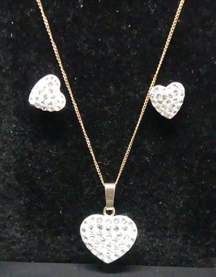 Lot 392 - A modern 9ct gold and cz set heart shaped...