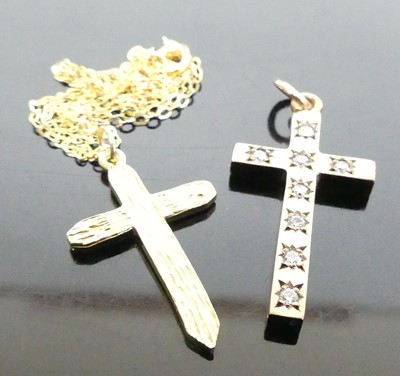 Lot 397 - A modern 9ct gold cross pendant on finelink...