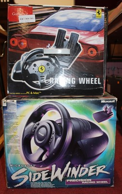 Lot 781 - A Microsoft Sidewinder precision racing wheel,...