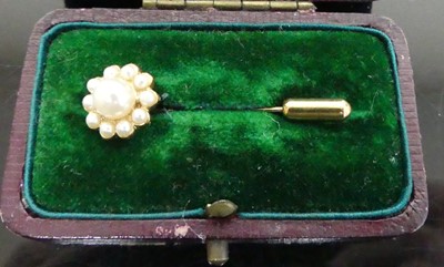 Lot 402 - A gilt metal and faux pearl set tie-pin, in...