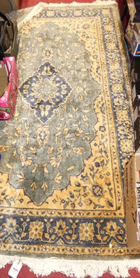 Lot 1153 - A Persian woollen mustard ground Tabriz rug,...
