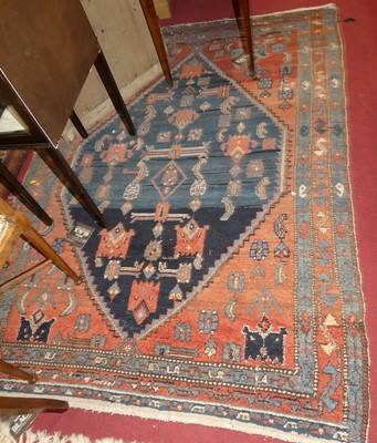 Lot 1156 - A Persian woollen red and blue ground Shiraz...
