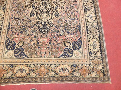 Lot 1161 - A Persian woollen red & cream ground Nain rug,...