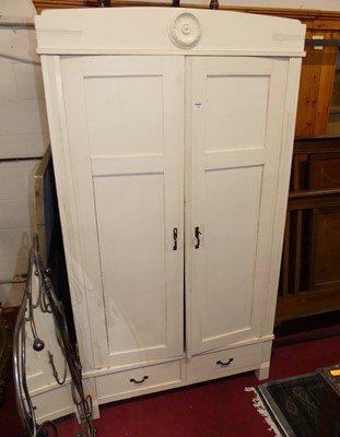 Lot 1182 - A cream painted pine double door wardrobe,...