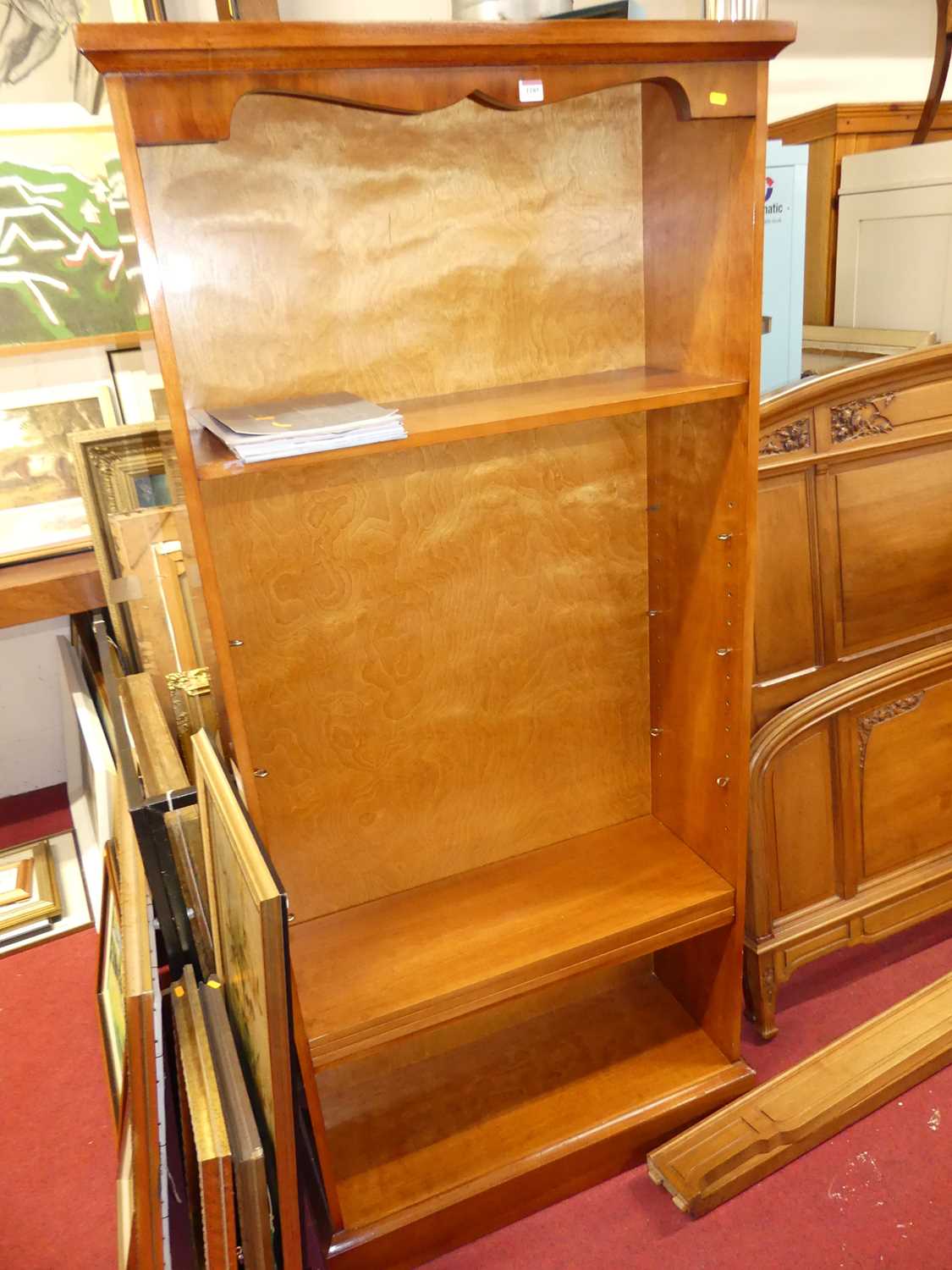 Lot 1185 - A contemporary yew wood free standing open...
