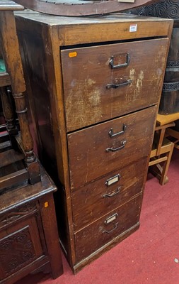 Lot 1199 - A stained plywood four drawer office filing...