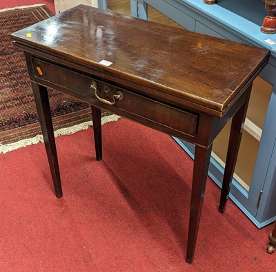 Lot 1210 - A George III mahogany fold-over tea table,...